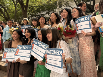 Group photo of students holding Match Day signs