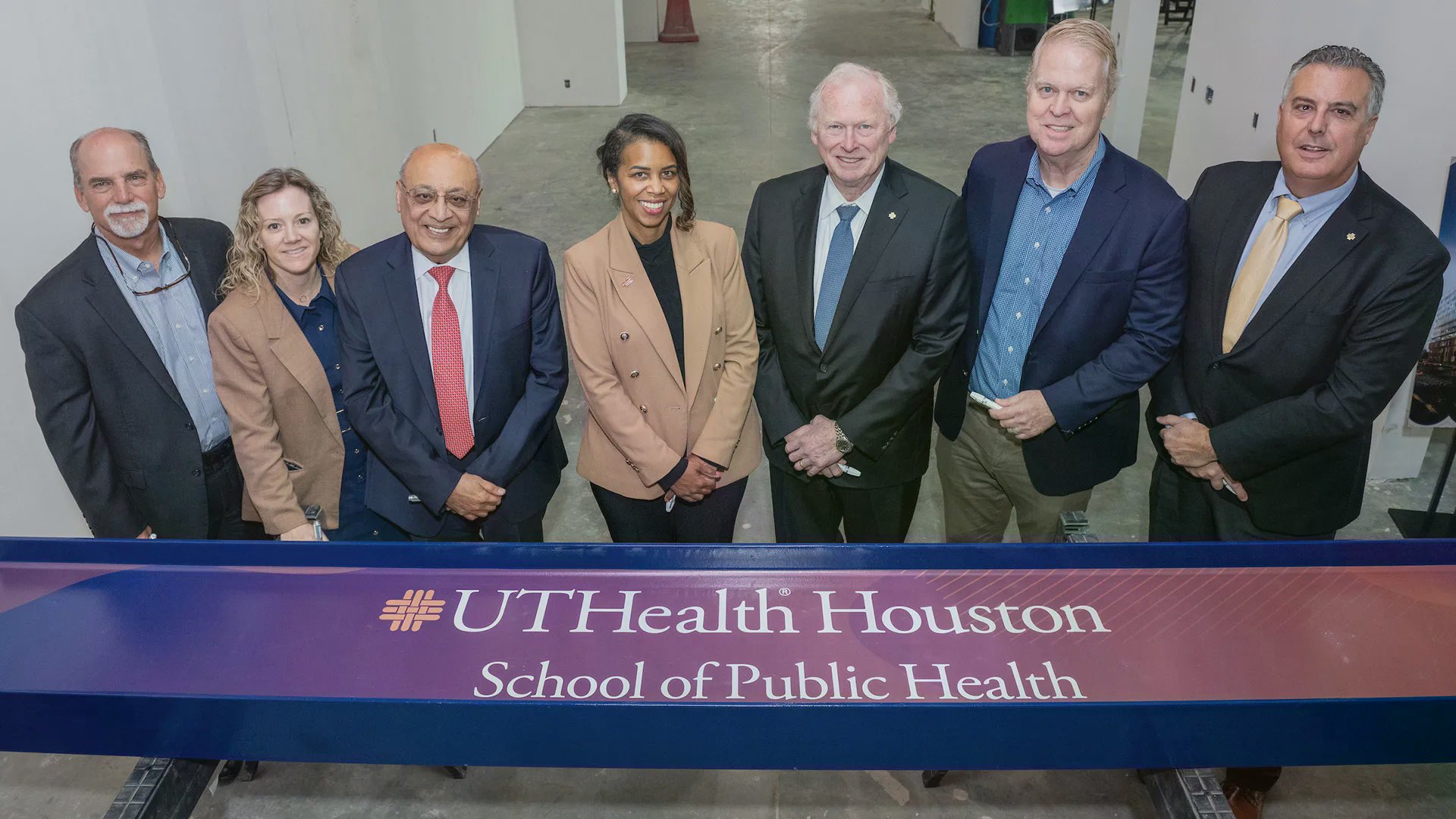 Topping out ceremony, people signing final beam.