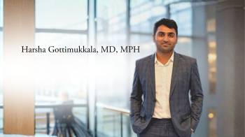 Harsha Gattimukkala, MD, MPH standing in front of office windows