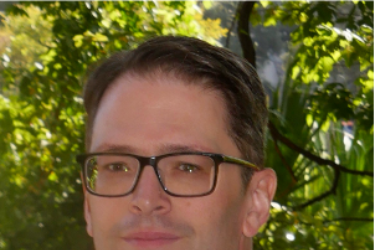 Benzer in front of bushes